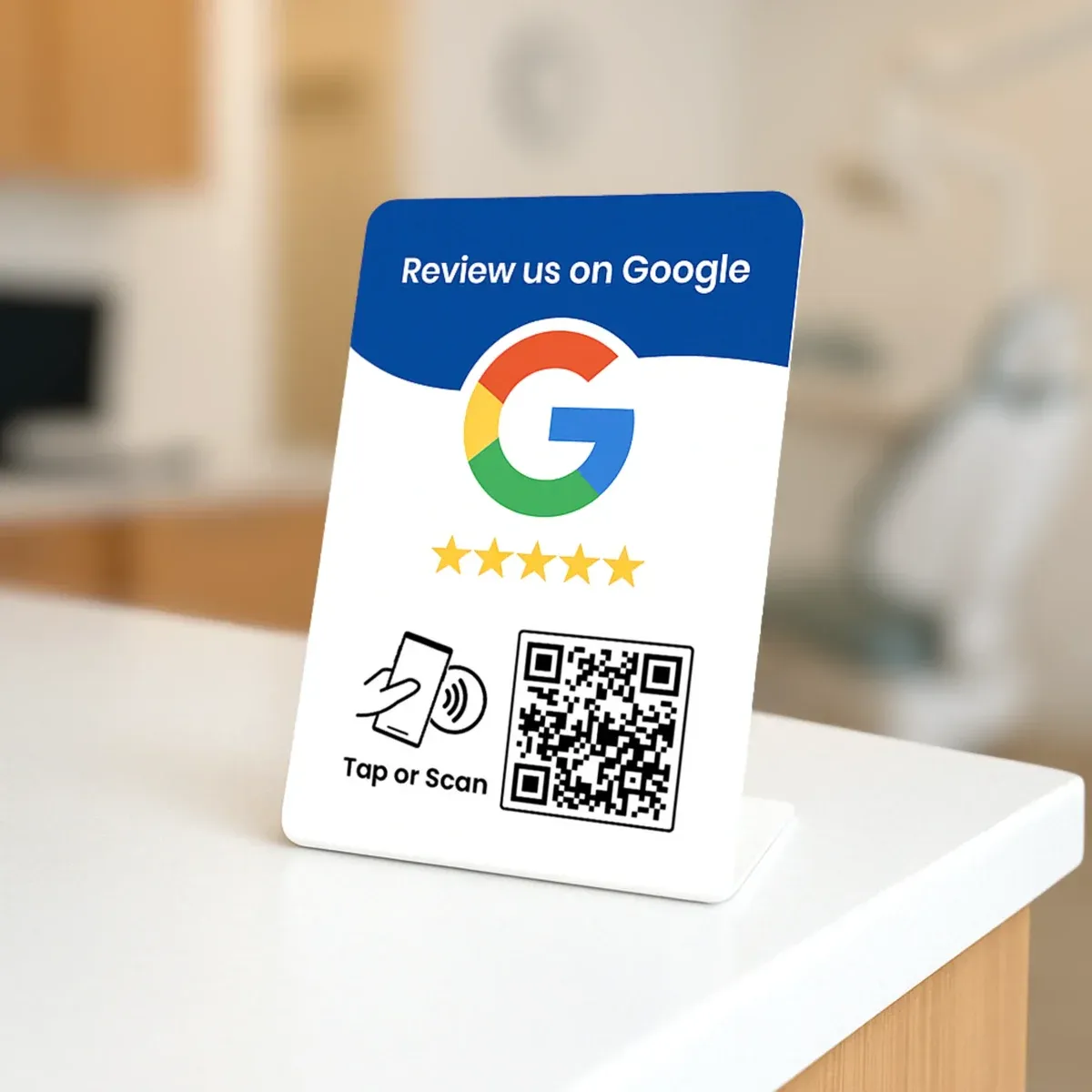 "Review us on Google" plate with NFC and QR code on a counter
